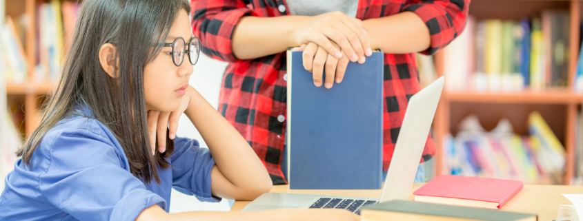 student studying in the school library